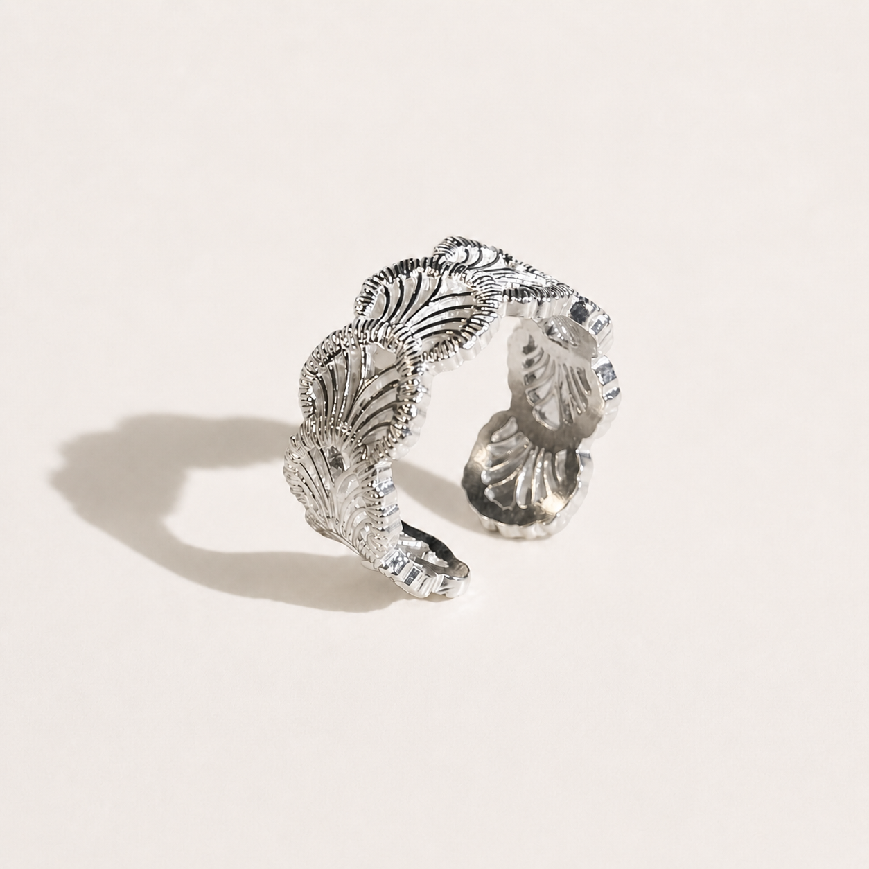 Gemina sterling silver open ring with intricate lace-texture engraving, adjustable fit