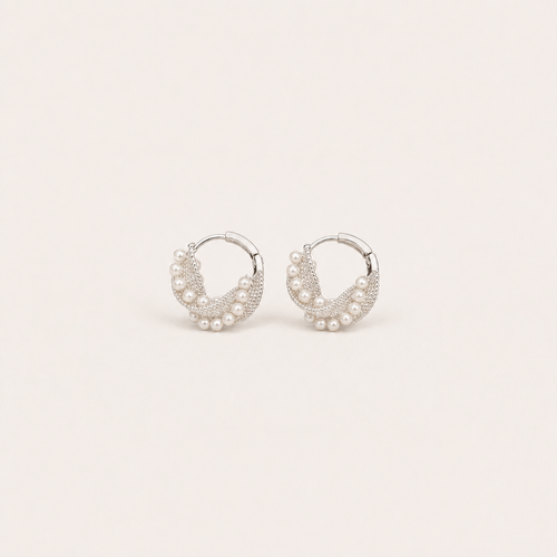 Gemina Manon silver huggie hoop earrings set with a beaded pearl wreath